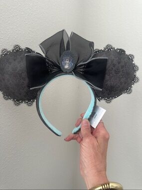 Disney’s The Haunted Mansion Black Lace Ear Headband with gray wallpaper
